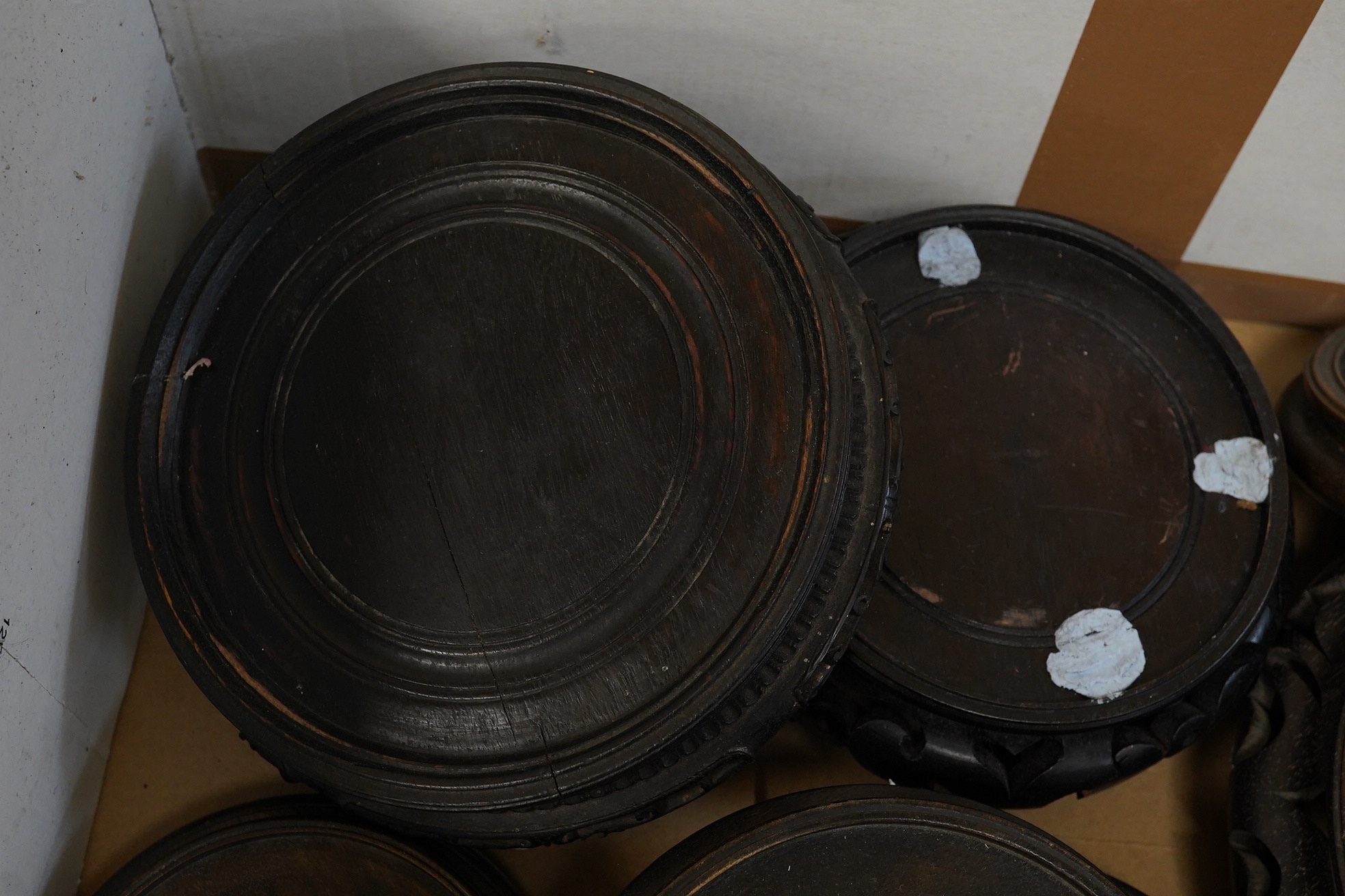 A group of Chinese hardwood stands largest 21cm in diameter. Condition - fair, some chips